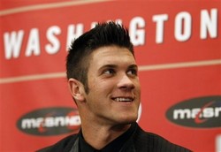 Baseball player Bryce Harper smiles during a news conference where the Washington Nationals introduced him as their first overall selection in the 2010 First-Year Player Draft, at Nationals Park in Washington Thursday, Aug. 26, 2010. Harper  agreed to a $9.9 million, five-year deal with the baseball club last week. (AP Photo/Alex Brandon)